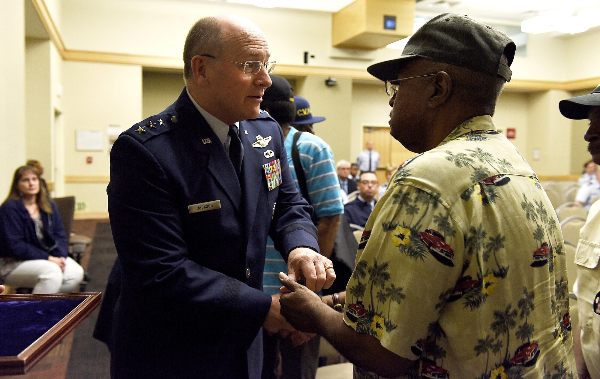 Lt. Gen. James Jackson, chief of the Air Force Reserve, presents a Vietnam War veteran with a pin during a ceremony at the Pentagon, Washington, D.C., June 21, 2016. More than 10 veterans were recognized during the ceremony. (U.S. Air Force photo by Staff Sgt. Alyssa C. Gibson/Released)