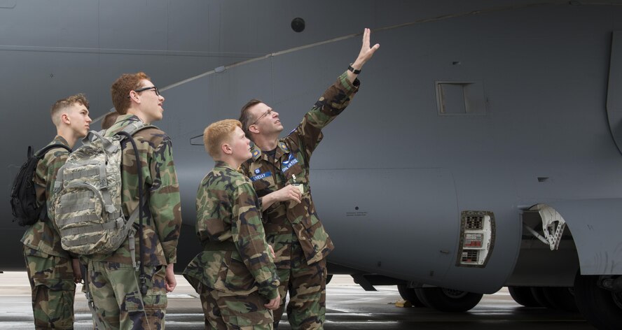 Maj. Michael Livesay, Ramstein Civil Air Patrol squadron commander, tells CAP cadets about the engines in a C-17A Globemaster III aircraft during a tour June 21, 2016, at Ramstein Air Base, Germany. CAP included cadets from Ramstein, Spangdalem Air Base, Germany and Mildenhall Air Base, England. They toured Ramstein from June 18 to 24, and visited squadrons associated with all three wings on base to get a glimpse of what life is like as an Airman. (U.S. Air Force photo/Airman 1st Class Tryphena Mayhugh)