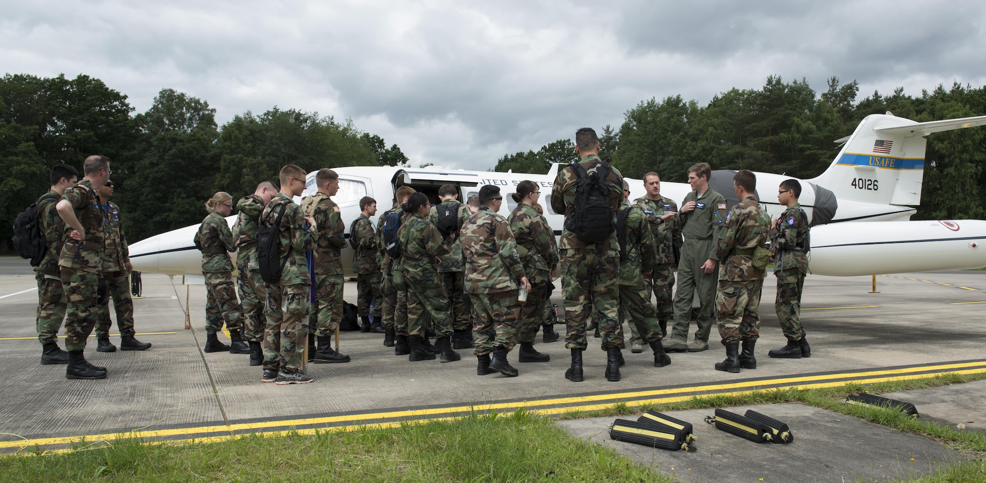 Civil Air Patrol cadets and cadres gather round a Gates Learjet C-21A aircraft during a tour June 22, 2016, at Ramstein Air Base, Germany. The 86th Aeromedical Evacuation Squadron and 76th Airlift Squadron hosted this portion of the tour, allowing the cadets to see inside the plane. CAP toured Ramstein from June 18 to 24, and visited squadrons associated with all three wings on base to get a glimpse of what life is like as an Airman. (U.S. Air Force photo/Airman 1st Class Tryphena Mayhugh)