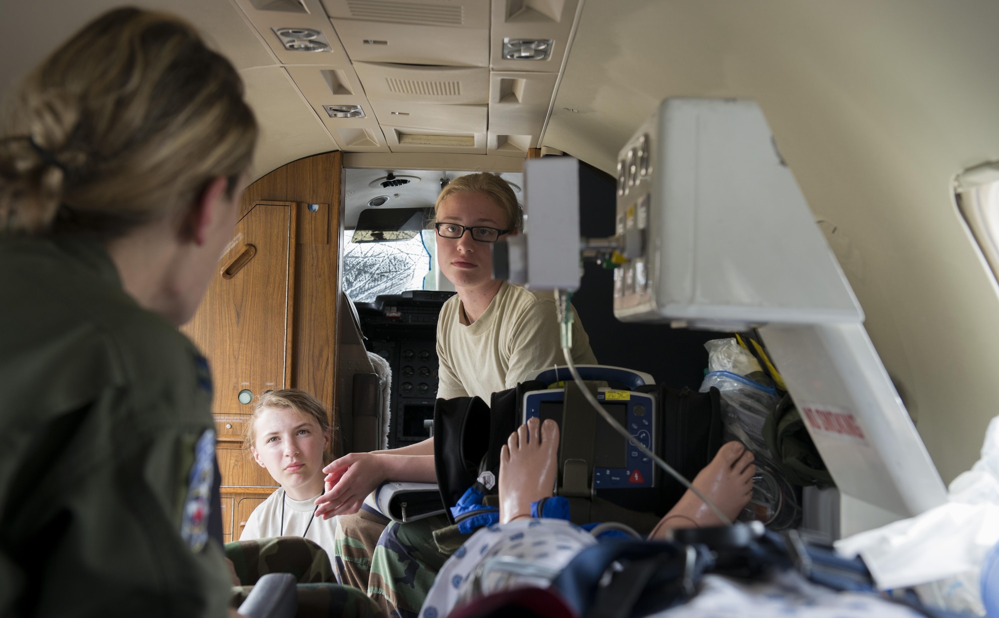 Capt. Erin Wood, 86th Aeromedical Evacuation Squadron flight nurse, shows Civil Air Patrol cadets inside a Gates Learjet C-21A aircraft during a tour June 22, 2016, at Ramstein Air Base, Germany. The aircraft was set up to demonstrate how a patient would be cared for on this aircraft during an aeromedical evacuation. CAP toured Ramstein from June 18 to 24, and visited squadrons associated with all three wings on base to get a glimpse of what life is like as an Airman. (U.S. Air Force photo/Airman 1st Class Tryphena Mayhugh)