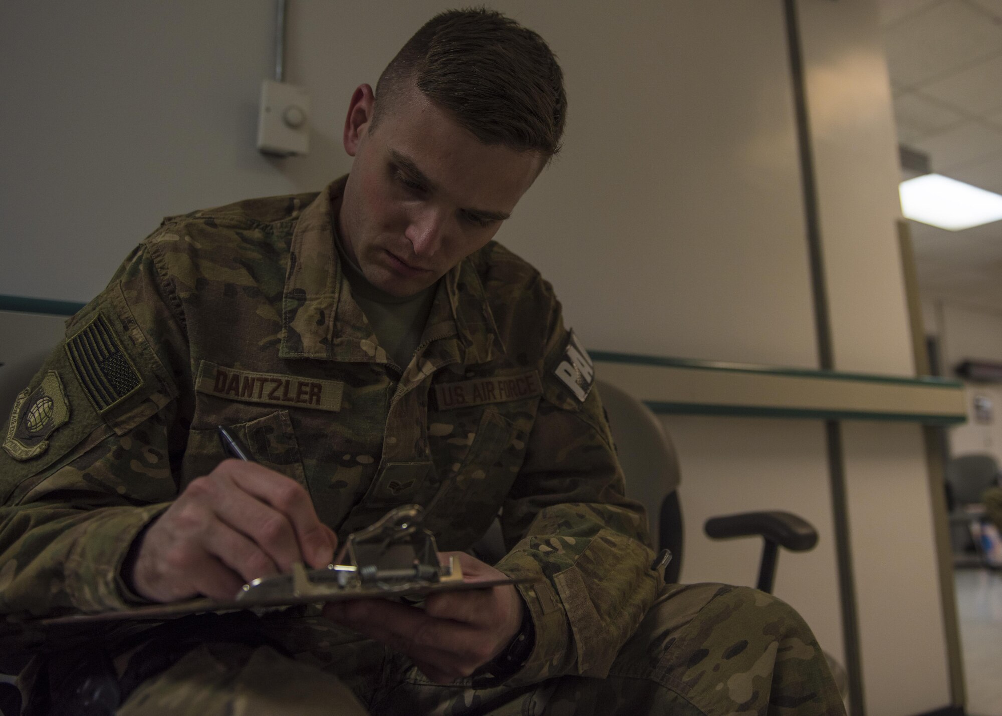 Senior Airman Robert Dantzler, 455th Air Expeditionary Wing public affairs, fills out forms to donate blood during an urgent need for blood donations, June 24, 2016, Bagram Airfield, Afghanistan. In an urgent call from the Craig Joint-Theater Hospital, all pre-screened personnel with B type blood reported to the hospital to donate blood. (U.S. Air Force photo by Senior Airman Justyn M. Freeman)
