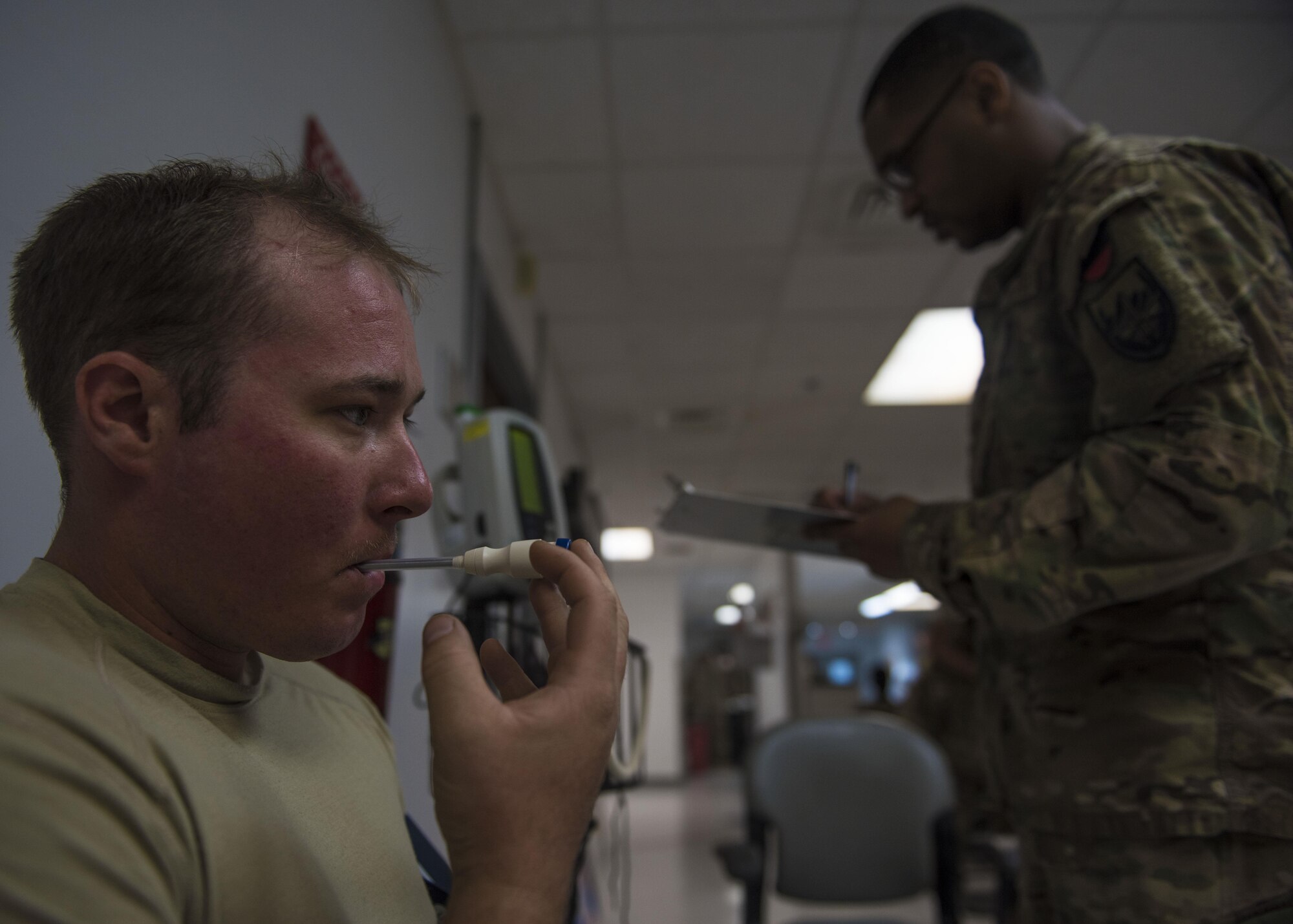 Senior Airman Joseph Matheson, 455th Expeditionary Civil Engineering Squadron pavements and equipment journeyman, has his temperature taken before donating blood during an urgent need for blood donations, June 24, 2016, Bagram Airfield, Afghanistan. Matheson is a pre-screened blood donator who came to donate blood during a shortage of platelets. (U.S. Air Force photo by Senior Airman Justyn M. Freeman)