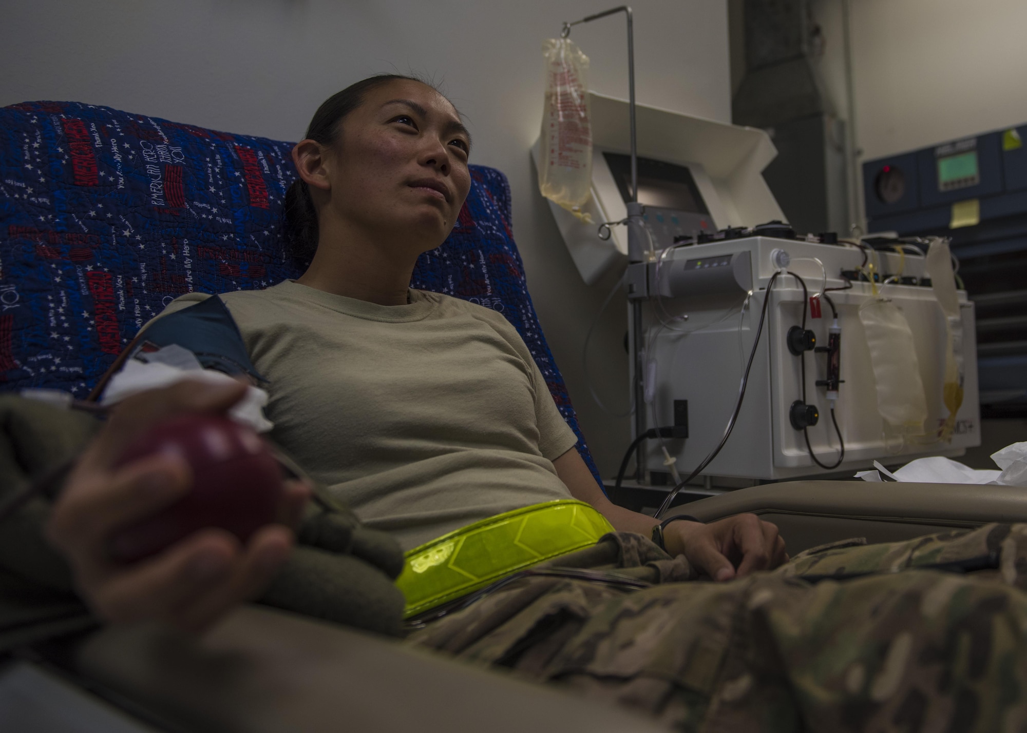 Capt. Kellyanne Matsuoka, 455th Expeditionary Aircraft Maintenance Squadron operations officer, donates blood during an urgent need for blood donations, June 24, 2016, Bagram Airfield, Afghanistan. In an urgent call from the Craig Joint-Theater Hospital, all pre-screened personnel with B type blood reported to the hospital to donate blood. (U.S. Air Force photo by Senior Airman Justyn M. Freeman)