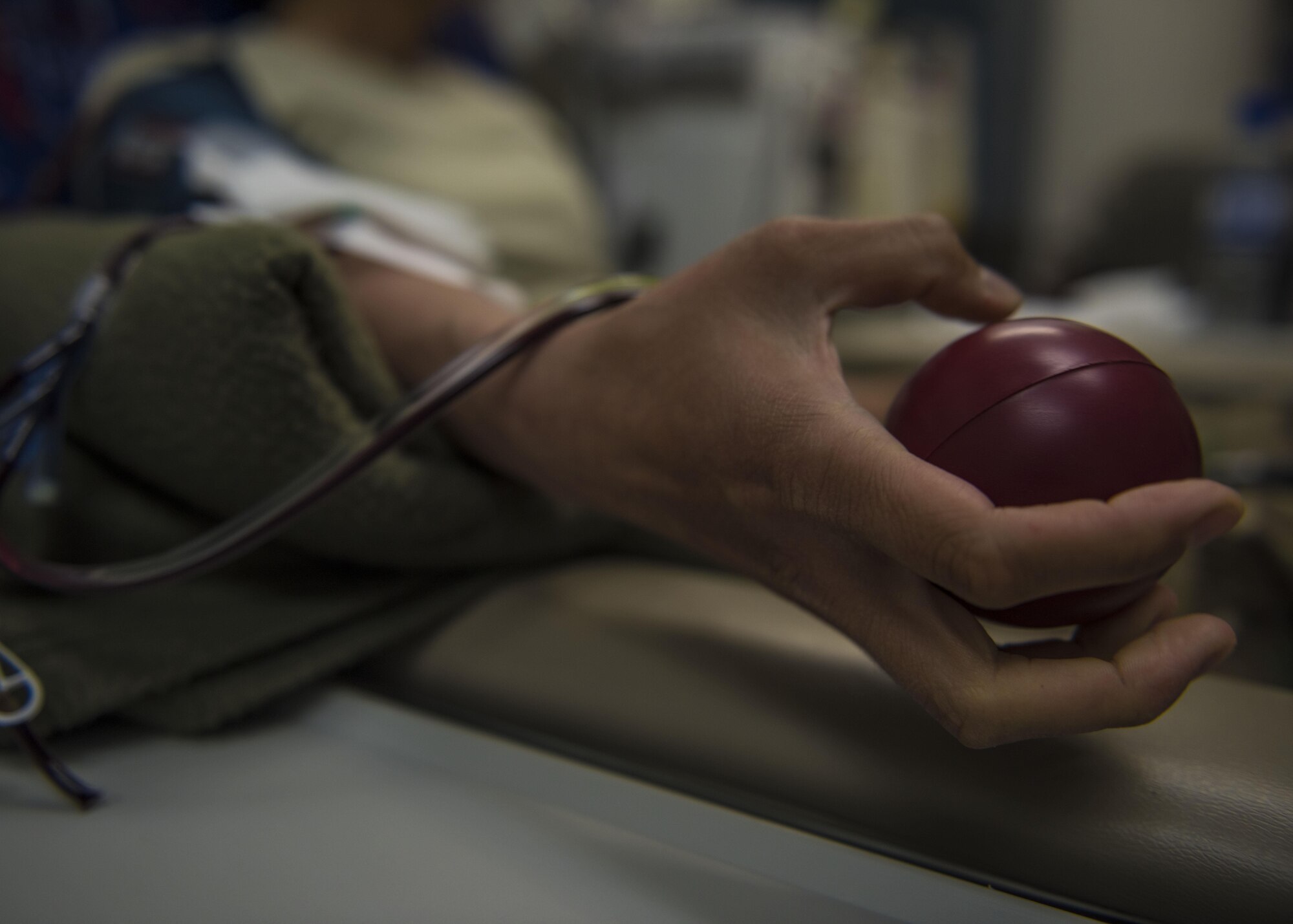 Capt. Kellyanne Matsuoka, 455th Expeditionary Aircraft Maintenance Squadron operations officer, donates blood during an urgent need for blood donations, June 24, 2016, Bagram Airfield, Afghanistan. The Craig Joint-Theater Hospital called for all B type, pre-screened donors to come and donate during a shortage in an effort to save lives. (U.S. Air Force photo by Senior Airman Justyn M. Freeman)