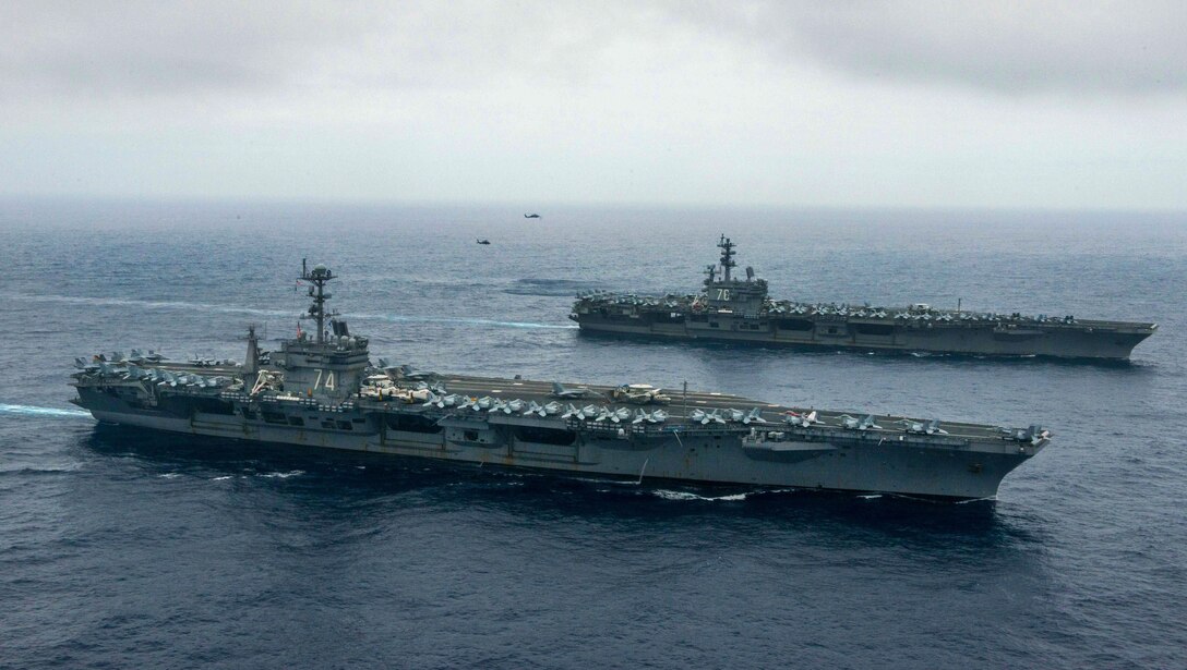 The Nimitz-class aircraft carriers USS John C. Stennis and USS Ronald Reagan conduct dual aircraft carrier strike group operations in the Philippine Sea, June 18, 2016. Navy photo by Petty Officer 3rd Class Jake Greenberg