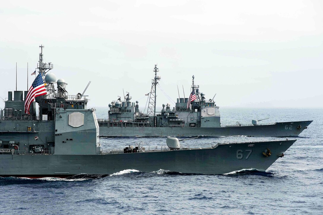 The guided-missile cruisers USS Shiloh, foreground, and USS Chancellorsville transit the Philippine Sea, June 18, 2016, while providing security and stability in the Indo-Asia-Pacific region. Navy photo by Petty Officer 2nd Class Ryan J. Batchelder