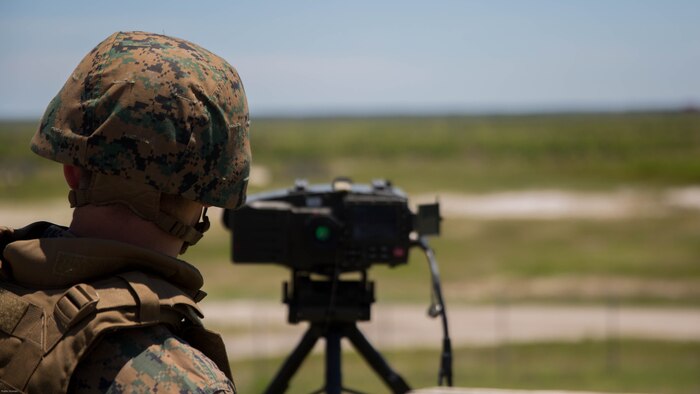 A Marine student with the Tactical Air Control Party course, conducted by Expeditionary Warfare Training Group-Atlantic, determines the range of enemy targets during a two-day live-fire exercise at Marine Corps Base Camp Lejeune, N.C., June 20-21, 2016. The five-week course certifies Marines in safely and efficiently employing fixed and rotor-wing aircraft in close proximity to friendly forces.