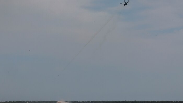 A UH-1Y Venom utility helicopter provides close air support during a two-day, joint tactical air control exercise at Marine Corps Base Camp Lejeune, N.C., June 20-21, 2016. Marine students in the tactical air control party course were required to identify enemy strongholds, plot coordinates, and request air support while artillery and mortars suppressed the positions.