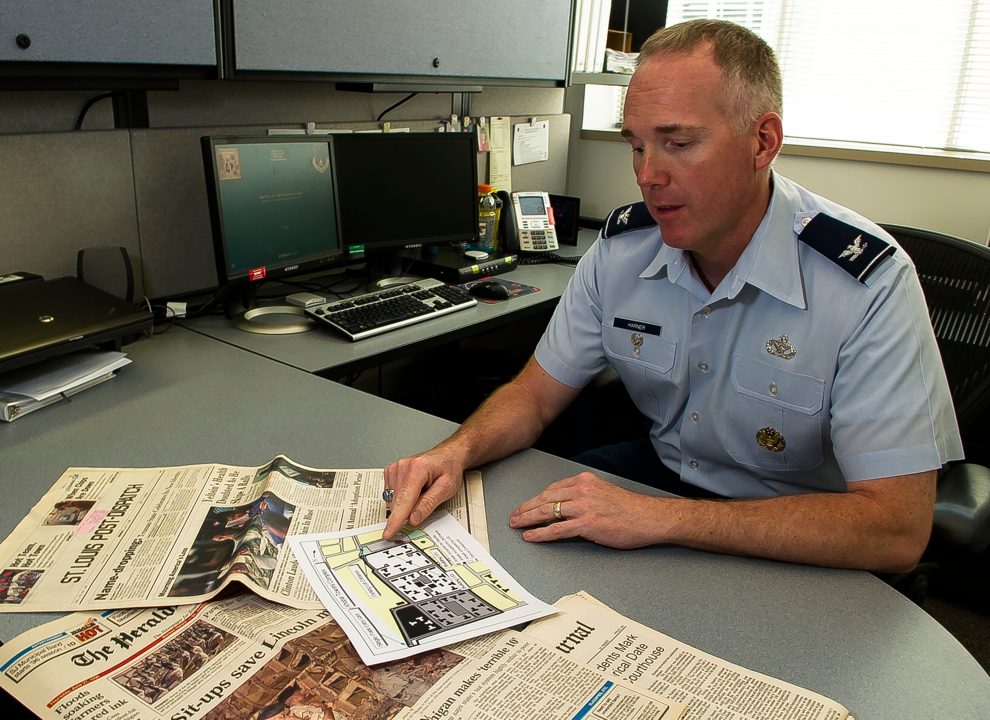 Col. Michael Harner, the associate director of civil engineers at the Pentagon in Washington, D.C., points to a spot on a map June 9, 2016, where the terrorist attack occurred on the Khobar Towers complex in Dharan, Saudi Arabia, on June 25, 1996. Harner was inside a building next to Bldg. 131, which was destroyed by a truck bomb. The attack killed 19 Airmen and injured more than 350 people, including Harner. (U.S. Air Force photo/Staff Sgt. Christopher Gross)