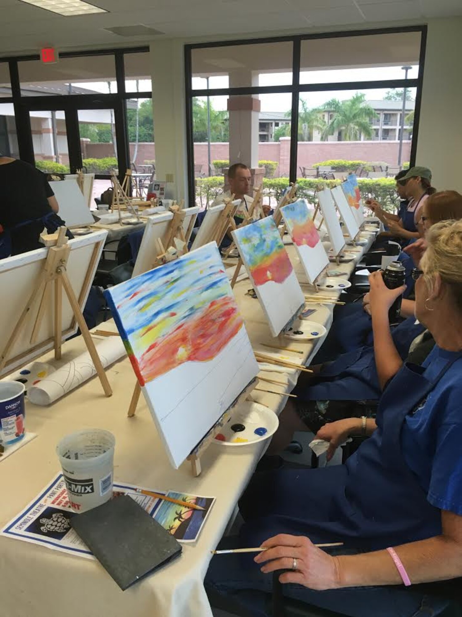 Airmen paint tropical beaches during a Recharge for Resiliency ‘Art for Good’ painting event in the Community Activity Center at Homestead Air Reserve Base, Fla., April 1. Airmen maintain resiliency by building an Air Force community together. (Courtesy Photo)