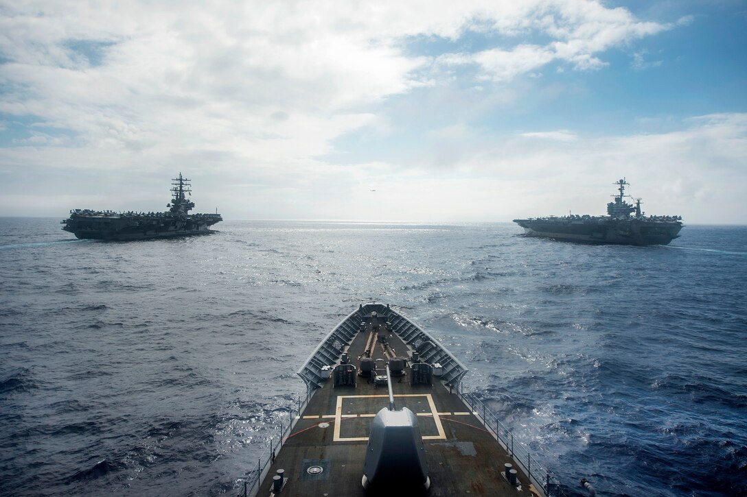 The Ticonderoga class guided-missile cruiser USS Shiloh steams in formation with the Nimitz-class aircraft carriers USS Ronald Reagan USS John C. Stennis in the Philippine Sea, June 19, 2016. Navy photo by Petty Officer 3rd Class Alonzo M. Archer