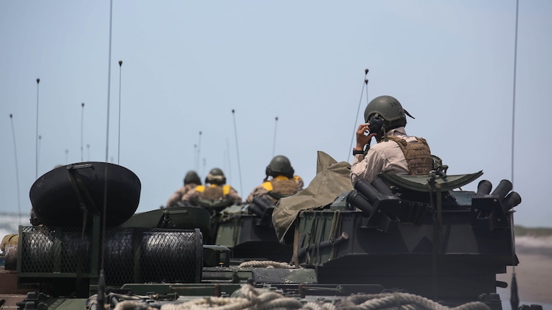 Marines with Charlie Company, 4th Assault Amphibian Battalion move down the beach during water operations at Marine Corps Base Camp Lejeune, N.C., June 22, 2016. The company, based in Galveston, Texas, conducted operations in land and sea to prepare for their upcoming unit deployment program to Okinawa. 