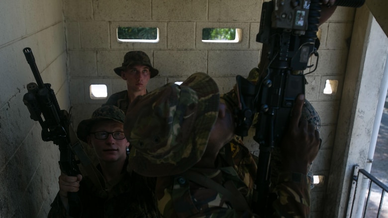 Lance Cpl. Jacob W. Anderson practices clearing a stairwell with a fire team made of Marines and soldiers with the Papua New Guinea Defence Force, June 19, 2016, at Taurama Barracks, as part of Exercise Koa Moana. Koa Moana, the first exercise between U.S. Marines and the PNGDF directly, is designed to increase interoperability and relations by sharing infantry, engineering, medical and law enforcement capabilities. 