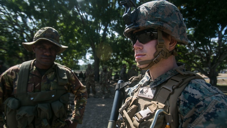 Cpl. Steven C. Anderson prepares his fire team to conduct a patrol Exercise Koa Moana, June 19, 2016, at Taurama Barracks, Papua New Guinea Defence Force. Koa Moana is a multi-national, bilateral exercise designed to increase interoperability and relations by sharing infantry, engineering, law enforcement and medical skills to preserve and promote peace in the Asia-Pacific region.