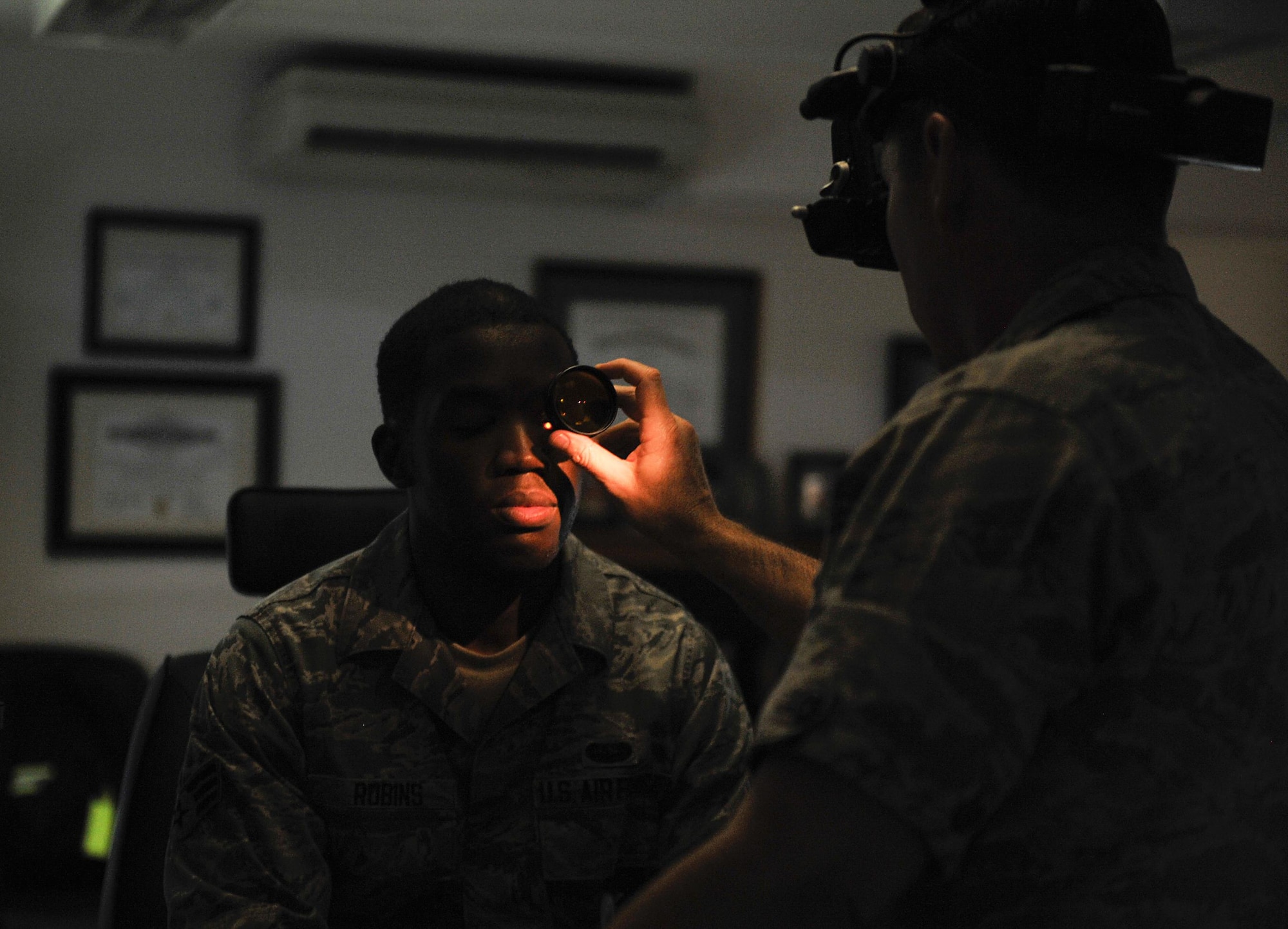Senior Airman Jonathan Robins, 1st Combat Communications Squadron maintenance operations center technician, receives an eye exam June 23, 2016, at Ramstein Air Base, Germany. The 86th Aerospace Medicine Squadron optometry clinic works to ensure all patients receive the medical care they need to ensure the best eye health possible. (U.S. Air Force photo/Senior Airman Larissa Greatwood)