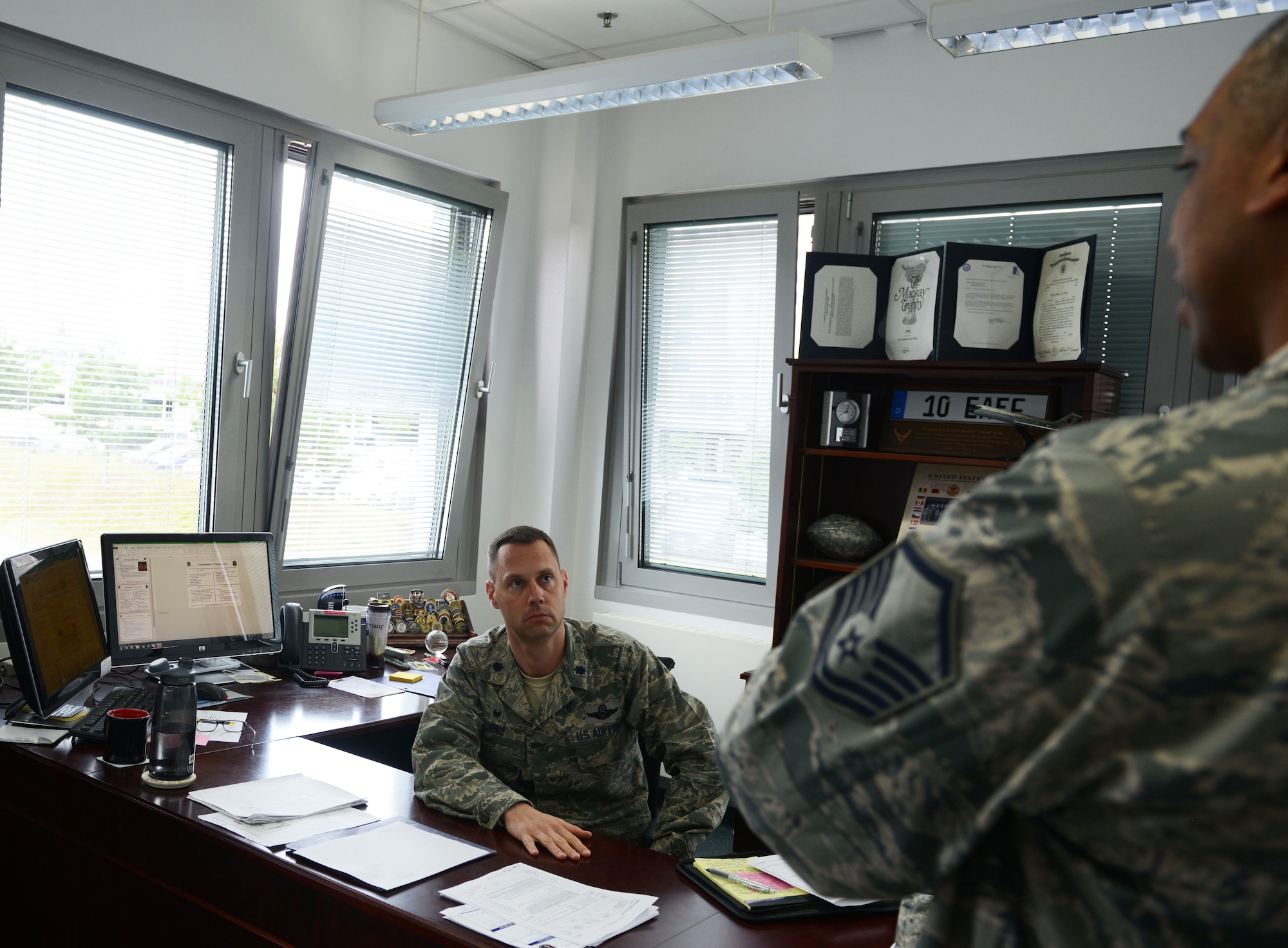 Lt. Col. Lucas Jobe, 313th Expeditionary Operations Support Squadron commander, receives a briefing from Master Sgt. Robert McNeal, 313th EOSS superintendent, at Ramstein Air Base, Germany, June 21, 2016. The 313th EOSS supports Air Mobility Command aircrew transiting through Ramstein en route to deployed locations. (U.S.  Air Force photo/ Airman 1st Class Joshua Magbanua)
 
