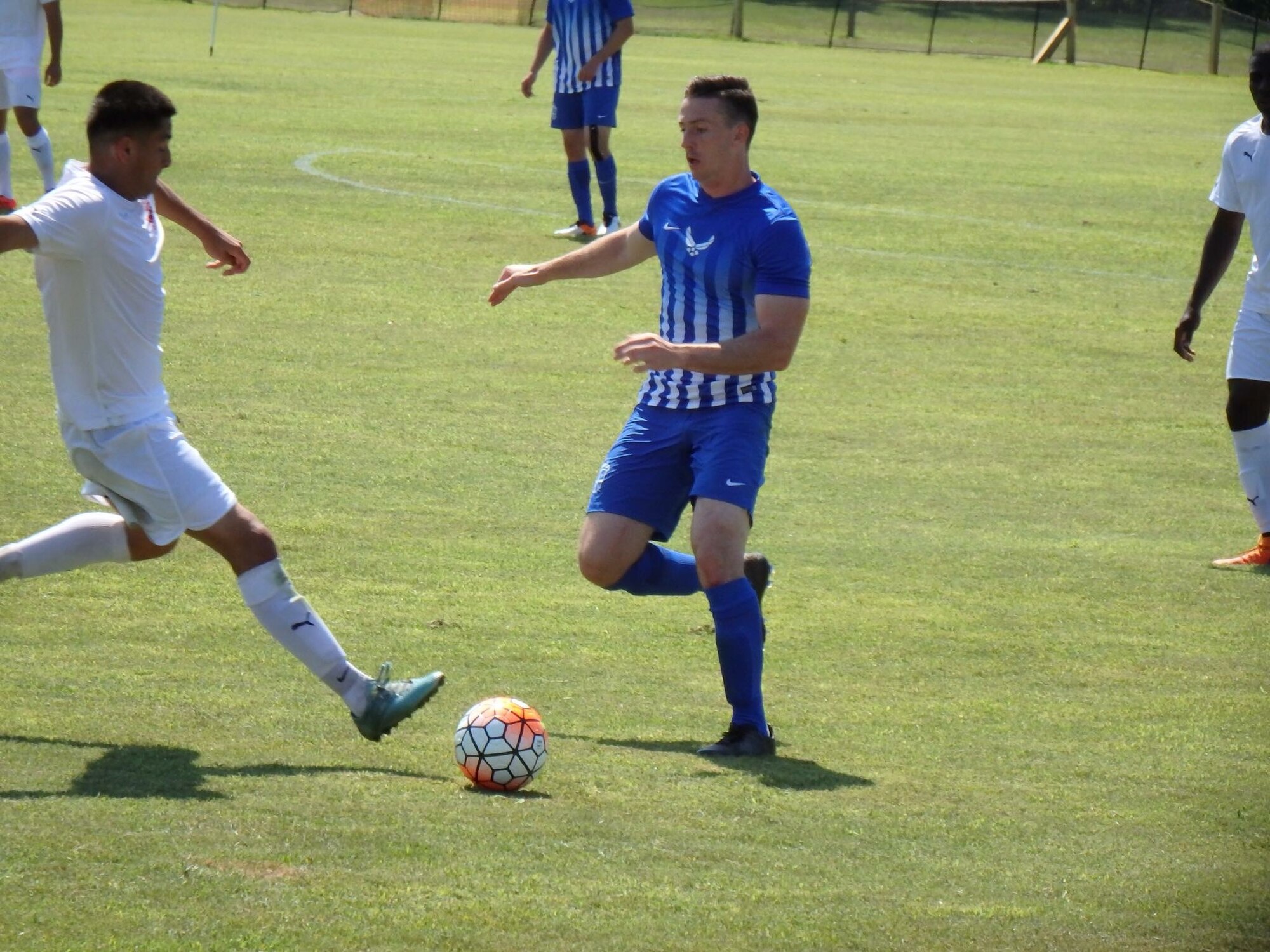 Airman 1st Class Timothy Bettes, 48th Force Support Squadron career development technician, competes in a soccer match against the U.S. Marine Corps team during the Armed Forces Men’s Soccer Championship tournament at Fort Benning, Georgia. Airmen from across the Air Force tried out for the U.S. Air Force soccer team. Bettes represented Royal Air Force Lakenheath, England, playing defense for the Air Force. (Courtesy photo) 