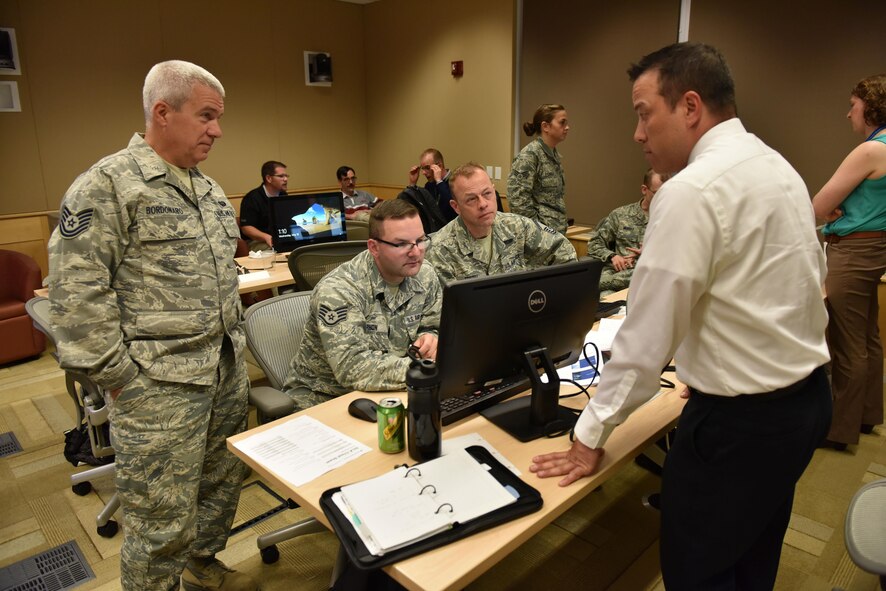 Communications Airmen work together during exercise Cyber Lightning at Carnegie Melon University, Pennsylvania, May 18, 2016. The cyber security exercise brought together Airmen of three different  bases: the 911th Airlift Wing, the 910th AW and the 171st Air Refueling Wing. (U.S. Air Force photo by Airman Beth Kobily)