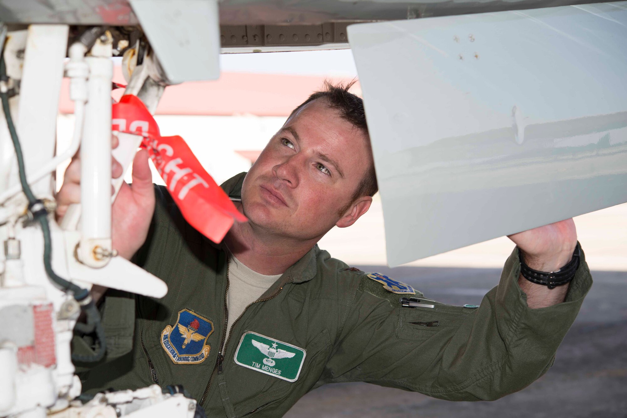Maj. Tim Menges, 560th Flying Training Squadron Instructor Pilot conducts a pre-flight inspection of a T-38C Talon at Joint Base San Antonio-Randolph Texas. Menges safely landed at Victoria Regional Airport Jan. 25, 2016, after a bird air strike knocked out the plane's electrical system. (U.S. Air Force photo by Randy Martin)