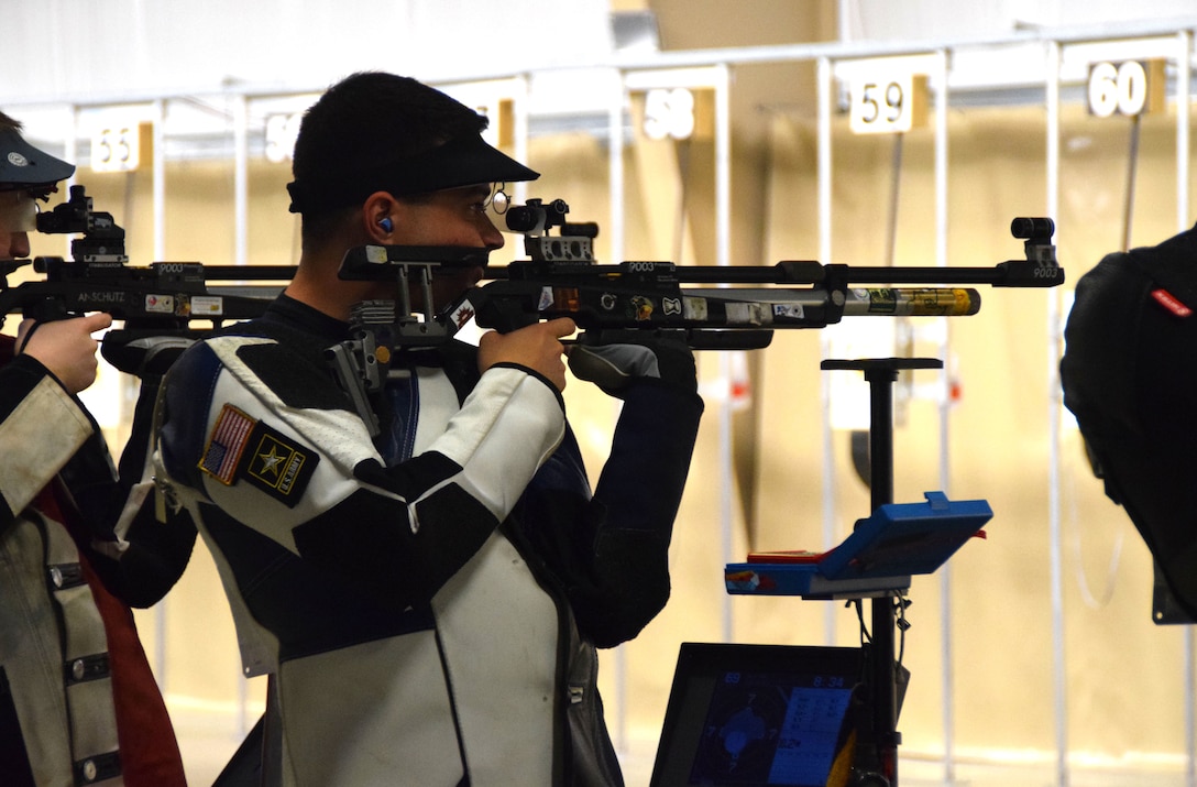 Army Spc. Dan Lowe, U.S. Army Marksmanship Unit, aims downrange during the 2016 Air Olympic trials at Camp Perry, Ohio, May 22, 2016. Lowe won an air rifle seat on the U.S. Olympic Shooting Team during June 5 Olympic trials, and will join three other USAMU soldiers at the 2016 Summer Olympic Games in Rio de Janeiro in August. Army photo by Brenda Rolin
