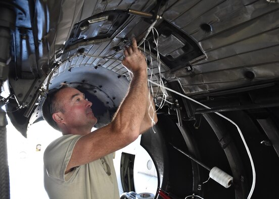 Master Sgt. Jim Buist, a 910th Airlift Wing Maintenance Squadron aircraft technician, repairs the turbine overheat system on a C-130 number three engine here June 14, 2016. A team of maintenance personnel towed the aircraft to a maintenance hangar to have the work done. (U.S. Air Force photo/Staff Sgt. Rachel Kocin)