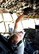 Staff Sgt. Gene Tucholski a C-130 crew chief with the 910th Aircraft Maintenance Squadron, operates the braking system of a C-130 Hercules aircraft during towing operations here, June 14, 2016. Maintenance uses teams of spotters and operators to safely move aircraft between hangars and parking spots. (U.S. Air Force photo/Staff Sgt. Rachel Kocin)