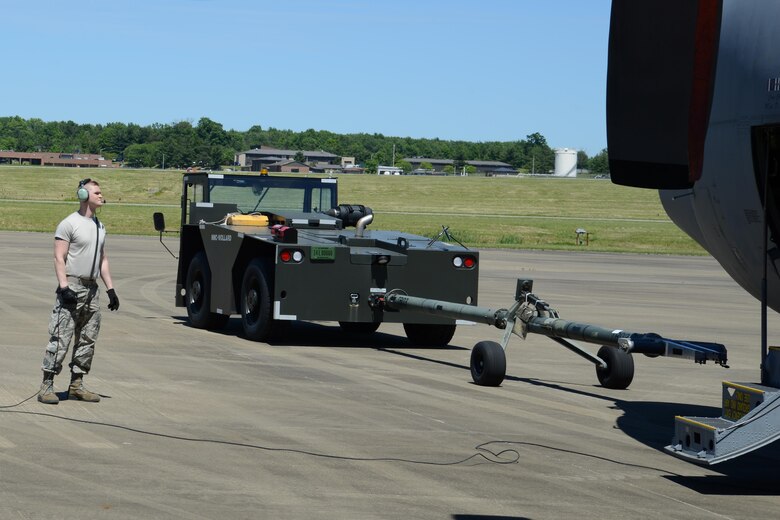 Airmen at Work Teamwork ensures safe aircraft towing > Youngstown Air