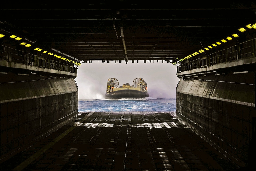 160618-N-OF476-140

ARABIAN GULF (June 18, 2016) A landing craft air cushion prepares to enter the well deck of amphibious assault ship USS Boxer in the Arabian Gulf, June 18, 2016. The Boxer is supporting maritime security operations and theater security cooperation efforts in the U.S. 5th Fleet area of operations. Navy photo by Seaman Eric Burgett