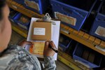 U.S. Air Force Airman 1st Class Emily Reed, 19th Logistics Readiness Squadron flight service center journeyman, tags a coupling clamp to maintain accountability of the product June 8, 2016, at Little Rock Air Force Base, Ark. The 19th LRS has maintained a 98-percent inventory accuracy rate over the past year, surpassing the Air Mobility Command’s 97-percent standard. (U.S. Air Force photo by Airman Kevin Sommer Giron)