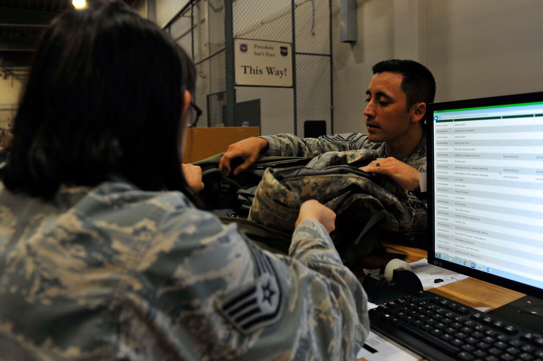 U.S. Air Force Master Sgt. John Torres, 19th Civil Engineer Squadron power production non-commissioned officer in charge, returns his individual protective equipment June 8, 2016, at Little Rock Air Force Base, Ark. The IPE office equips Airmen with life-saving chemical gear and individual body armor for contingency deployments. (U.S. Air Force photo by Airman Kevin Sommer Giron)