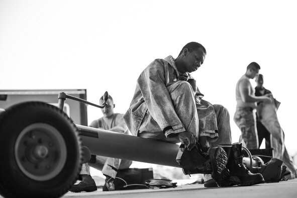 U.S. Air Force Senior Airman Zachary Moore, 23d Aircraft Maintenance Squadron Avionics Technician, dons personal protective equipment during an A-10C Thunderbolt II wash, June 16, 2016, at Moody Air Force Base, Ga. Hazardous material suits are required due to the chemicals used to clean the aircraft.(U.S. Air Force photo by Airman Daniel Snider/Released)