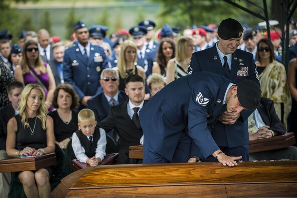Special tactics members pay their final respects to Lt. Col. William “Bill’ Schroeder during his interment ceremony June 16, 2016, at Arlington National Cemetery, Va. Schroeder, 39, was a special operations weather officer who identified a perilous situation and reacted swiftly by putting himself between an armed individual and his first sergeant. In the process, he saved lives of other squadron members while being fatally wounded. (U.S. Air Force photo/Airman 1st Class Philip Bryant)