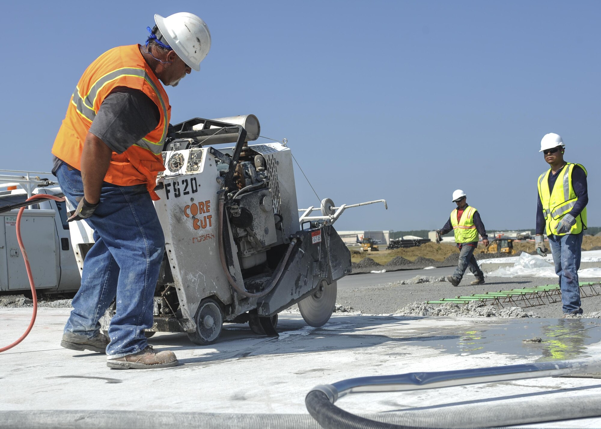 Mark Roncal, an Advanced Cutting Concrete and Sealing contractor, cuts concrete on the runway construction site June 21, 2016, at Little Rock Air Force Base, Ark. A section of Little Rock AFB runway is receiving an update from its original 1955 build. (U.S. Air Force photo by Senior Airman Mercedes Taylor) 