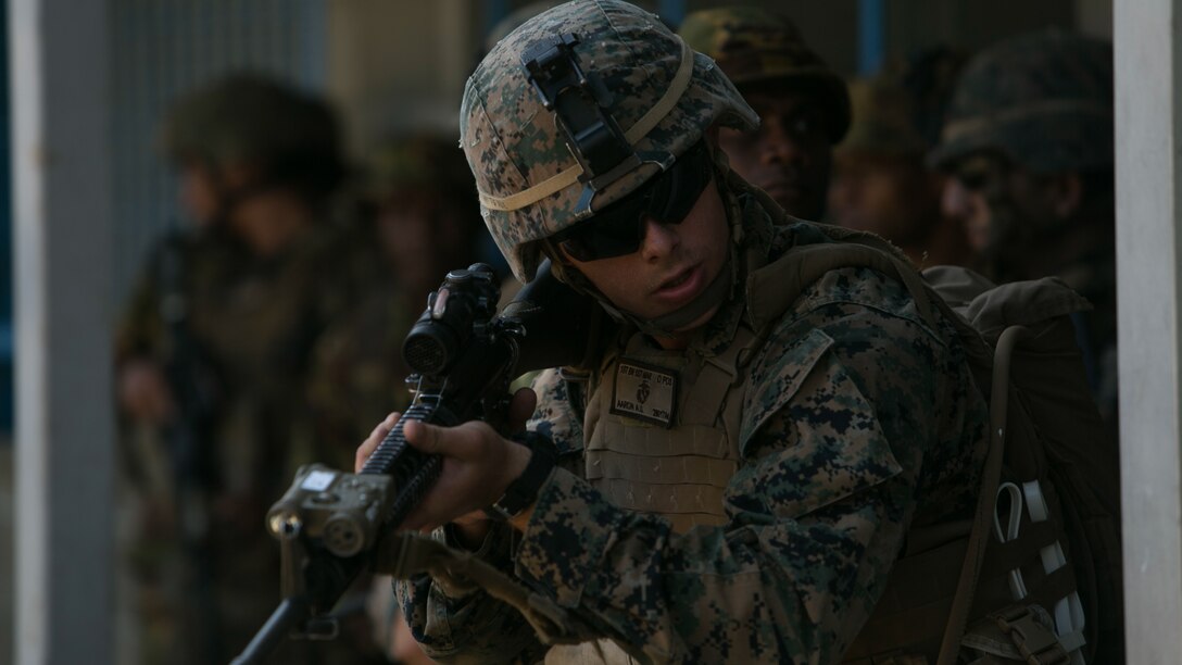 Lance Cpl. Abraham U. Aaron prepares to cross a notional danger zone during a patrol, June 19, 2016, at Taurama Barracks, Papua New Guinea, as part of Exercise Koa Moana. This is the first occasion for the Papua New Guinea and U.S. Marines to train directly. Koa Moana is a multi-national, bilateral exercise designed to increase interoperability and relations by sharing infantry, engineering, law enforcement and medical skills.
