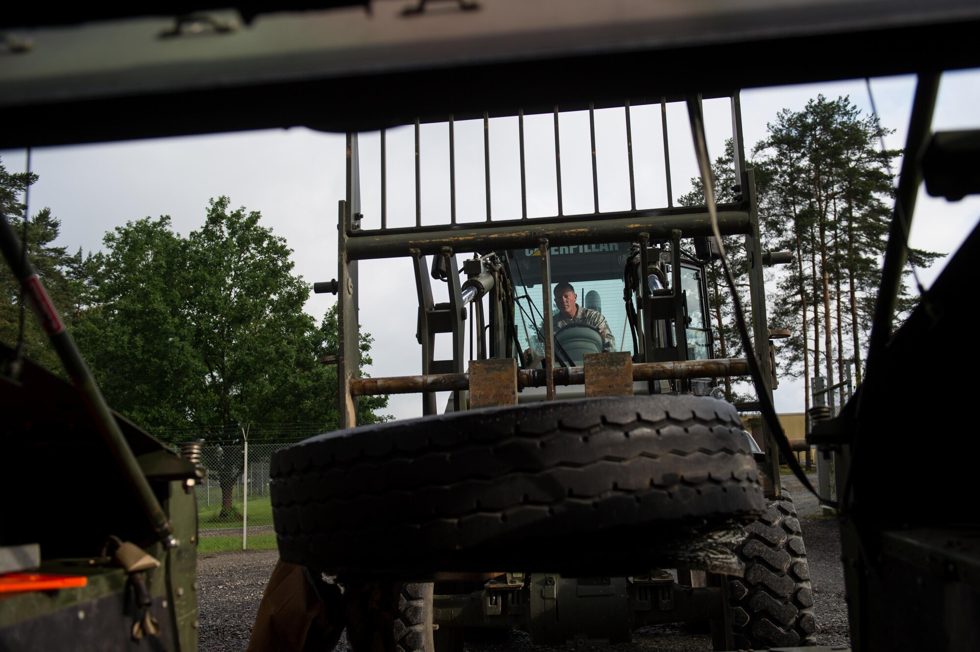 U.S. Air Force Master Sgt. Rodney Huffer, 921st Contingency Response Squadron airfield assessment team ramp coordinator, uses a fork lift to load supplies into a Humvee during Exercise Swift Response 16 at Grafenwoehr, Germany, June 14, 2016. Exercise SR16 is one of the premier military crisis response training events for multinational airborne forces in the world, the exercise has more than 5,000 participants from 10 NATO nations. (U.S. Air Force photo by Master Sgt. Joseph Swafford/Released)