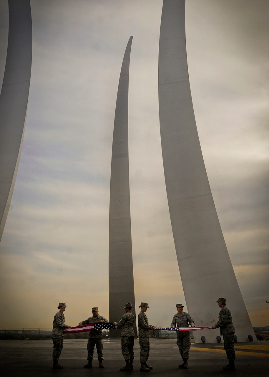 Air National Guardsmen from the 113th Wing of the Washington, D.C., Air National Guard fold American flags at the Air Force Memorial in Arlington, Va., April 11, 2014. In his speech at the June 24, 2016, retirement ceremony for Air Force Chief of Staff Gen. Mark A. Welsh III, Defense Secretary Ash Carter said Welsh lived by the motto inscribed in the base of the memorial: ‘Integrity first; service before self; excellence in all we do.’ Air National Guard photo by 1st Lt. Nathan T. Wallin
