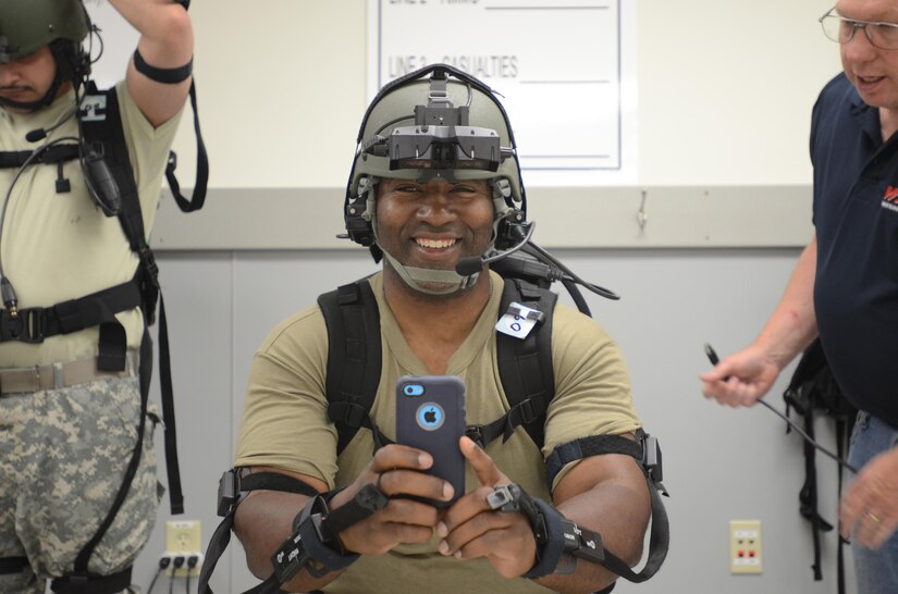 U.S. Army Reserve Staff Sgt. Carlos AdaCruz-Addison with the 138th MP Detachment out of Fort Bragg, N.C., takes a moment for a selfie while donning gear needed for the Dismounted Soldier Training System (DSTS) during exercise Guardian Justice at Fort McCoy, Wisc., June 21, 2016. The DSTS prepares soldiers for real world challenges through practice in a virtual environment. (U.S. Army photo by Spc. Adam Parent)
