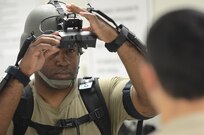 U.S. Army Reserve Soldiers from the 339th Military Police Company out of Davenport, Iowa, and the 138th MP Detachment out of Fort Bragg, N.C., don gear that will immerse them in a virtual world with the Dismounted Soldier Training System (DSTS) during exercise Guardian Justice at Fort McCoy, Wisc., June 21, 2016. The DSTS prepares soldiers for real world challenges through practice in a virtual environment. (U.S. Army photo by Spc. Adam Parent)