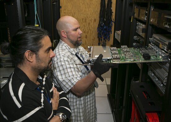 Jeff Compoc, 505th Test Squadron operations manager, oversees the installation of a part to a new weapons system upgrade at the Combined Air Operations Center-Nellis in 2016. For the COAC-N, this will be the first weapons system upgrade in over a decade. (Courtesy photo)