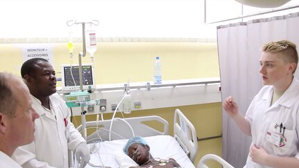 Spc. Charlotte McGuckin, (right), a health care specialist with the 212th Combat Support Hospital, translates operating room procedures conducted by French-speaking Gabonese doctors to English during a medical readiness training exercise, known as MEDRETE 16-4, held from May 22 to June 10, at the Hopital D’Instruction Des Armees in Libreville, Gabon. The exercise is a combined effort between the Gabonese government, U.S. Army Africa, the 212th CSH and the 3rd Medical Command (Deployment Support) from the U.S. Army Reserve. The exercise serves as an opportunity for U.S. and Gabonese forces to hone and strengthen their life saving skills as well as reinforce the partnership between both countries. (U.S. Army Africa photo by Capt. Charles An)