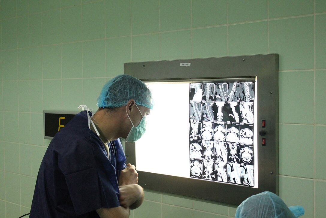 Sgt. Nicholas Bankston, an operating room technician with the 212th Combat Support Hospital, reviews x-rays during a medical readiness training exercise, known as MEDRETE 16-4, held from May 22 to June 10, at the Hopital D’Instruction Des Armees in Libreville, Gabon.  The exercise is a combined effort between the Gabonese government, U.S. Army Africa, the 212th CSH and the 3rd Medical Command (Deployment Support) from the U.S. Army Reserve. The exercise serves as an opportunity for U.S. and Gabonese forces to hone and strengthen their life saving skills as well as reinforce the partnership between both countries. (U.S. Army Africa photo by Capt. Charles An)