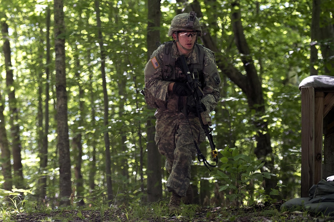 U.S. Army Spc. John Nicastro advances through the woods to his next objective during annual training at Camp Ethan Allen Training Site, Jericho, Vt., June 15, 2016. Nicastro is assigned to the Vermont National Guard’s Company A, 3rd Battalion, 172nd Infantry Regiment, 86th Infantry Brigade Combat Team. Air National Guard photo by Tech. Sgt. Sarah Mattison