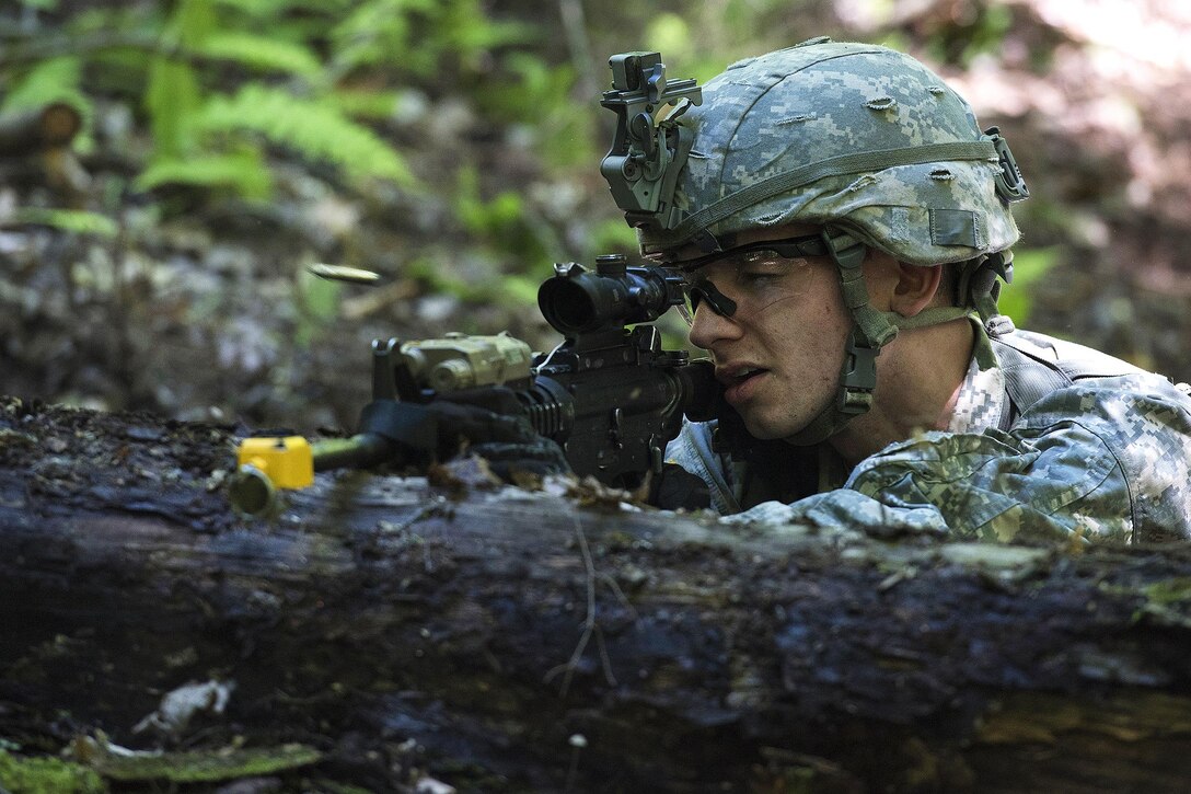 Army Spc. John Nicastro provides security and fires at opposing forces during annual training at Camp Ethan Allen Training Site, Jericho, Vt., June 15, 2016. Nicastro is assigned to the Vermont National Guard’s Company A, 3rd Battalion, 172nd Infantry Regiment, 86th Infantry Brigade Combat Team. Air National Guard photo by Tech. Sgt. Sarah Mattison