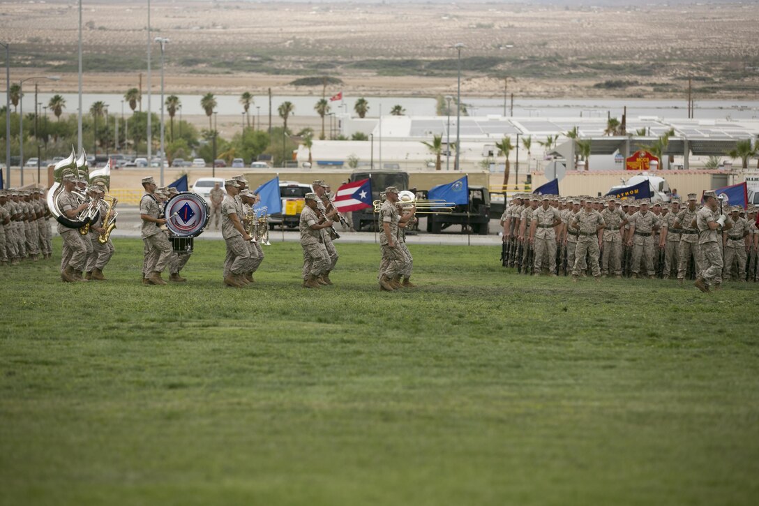 The 1st Marine Division Band marches past 1st Battalion, 7th Marine Regiment during the battalion’s change of command ceremony at Lance Cpl. Torrey L. Gray Field, June 21, 2016. (Official Marine Corps photo by Cpl. Thomas Mudd/Relased)