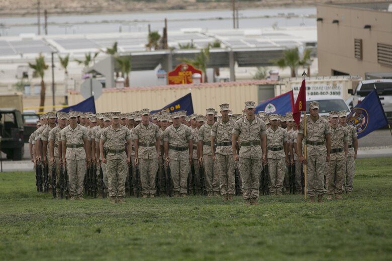 Marines of 1st Battalion, 7the Marine Regiment stand at the position of attention during the battalion’s change of command ceremony at Lance Cpl. Torrey L. Gary Field, June 21, 2016. (Official Marine Corps photo by Cpl. Thomas Mudd/Released)