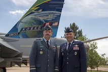 Lt.-Gen Pierre St-Amand, NORAD Deputy Commander, and Col Douglas Schiess, 21st Space Wing Commander, with the tail art of the new display of a CF-188A Hornet (tail number 188723) fighter jet at the Peterson Air and Space Museum at Peterson Air Force Base, Colo. June 24, 2016. The jet was donated by the Government of Canada to the USAF Heritage Program as a gesture of appreciation for the U.S. and Canada’s longstanding and continued partnership through the North American Aerospace Defense Command. The CF-188 has been used by Canada since 1984 to conduct NORAD’s missions. (Photo by TSgt Joe Laws, Released)