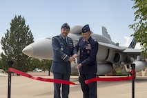 Lt.-Gen Pierre St-Amand, NORAD Deputy Commander, and Col Douglas Schiess, 21st Space Wing Commander, cut the ribbon on the new display of a CF-188A Hornet (tail number 188723) fighter jet at the Peterson Air and Space Museum at Peterson Air Force Base, Colo. June 24, 2016. The jet was donated by the Government of Canada to the USAF Heritage Program as a gesture of appreciation for the U.S. and Canada’s longstanding and continued partnership through the North American Aerospace Defense Command. The CF-188 has been used by Canada since 1984 to conduct NORAD’s missions. (Photo by TSgt Joe Laws, Released)