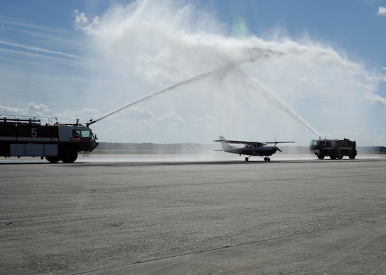 A Transfer of Authority ceremony held to recognize the realignment of the Civil Air Patrol-U.S. Air Force – or CAP-USAF – from Air Education and Training Command to Air Combat Command began with the arrival of a CAP C-182 Cessna carrying CAP’s National Commander CAP Maj. Gen. Joe Vazquez and the CAP-USAF commander, Col. Mike Tynismaa. The aircraft landed and approached Tyndall Air Force Base’s base operations, rolling through a ceremonial greeting of fire trucks pumping arching water sprays high over the aircraft. (U.S. Air Force photo by SrA Solomon Cook)