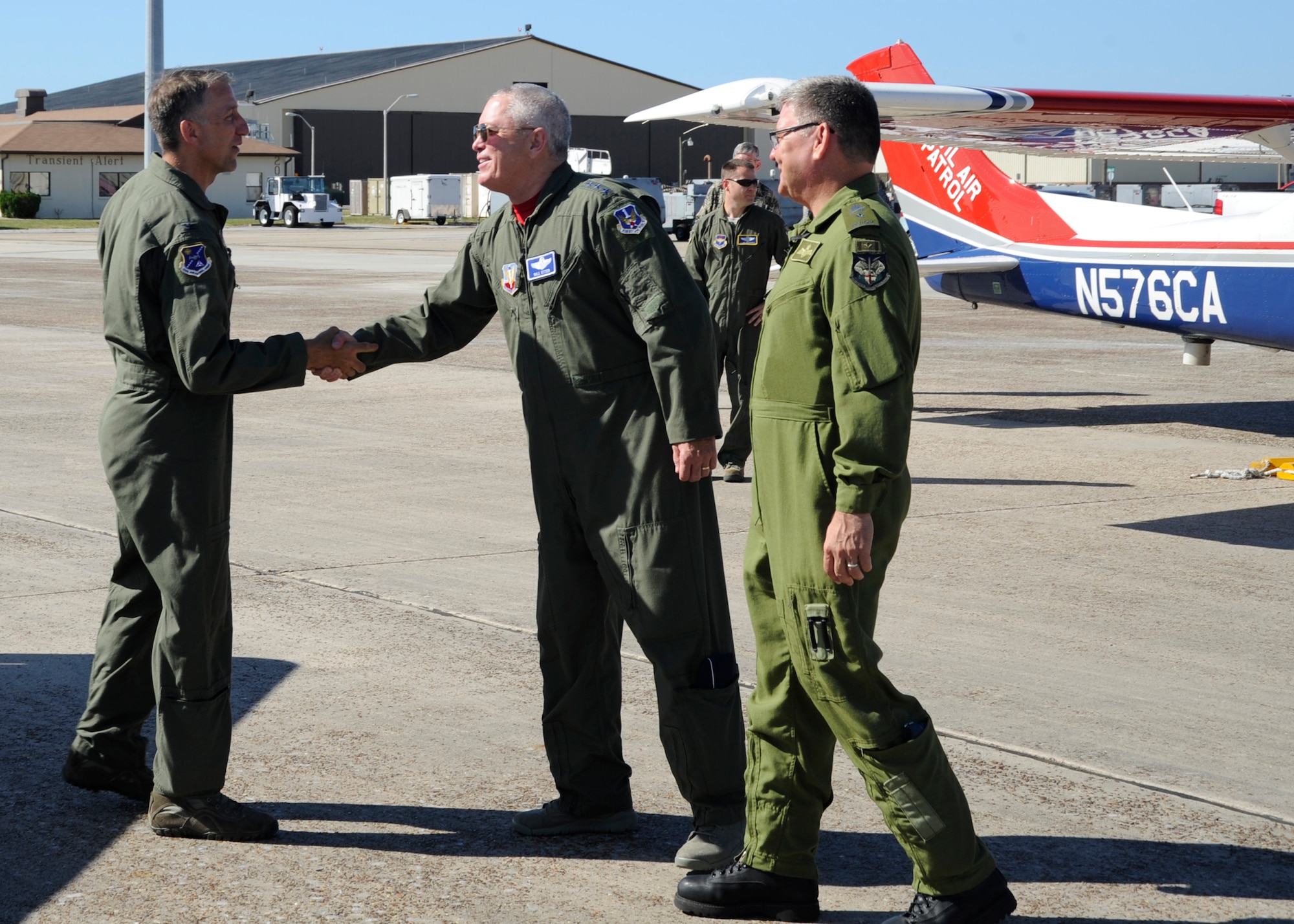 Civil Air Patrol National Command CAP Maj. Gen. Joe Vazquez (left) is greeted by Lt. Gen. William Etter, commander of Continental U.S. NORAD Region-1st Air Force (Air Forces Northern) and Canadian Brig. Gen. Paul Ormsby, CONR deputy commander. Vazquez visited Tyndall AFB to take part in the Transfer of Authority ceremony held to recognize the realignment of the Civil Air Patrol-U.S. Air Force – or CAP-USAF – from Air Education and Training Command to Air Combat Command. (U.S. Air Force photo by SrA Solomon Cook)