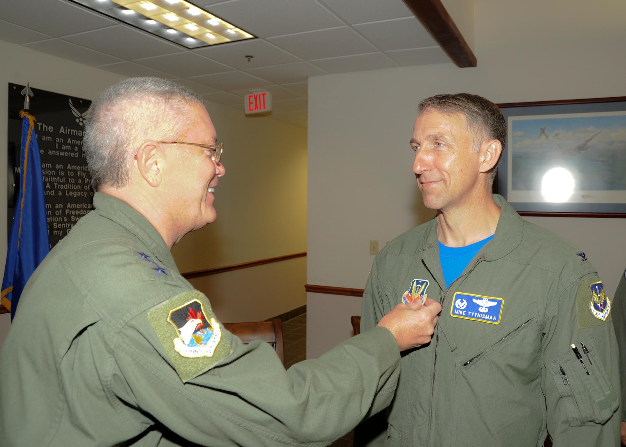 As part of the Transfer of Authority ceremony held today to recognize the realignment of the Civil Air Patrol-U.S. Air Force – or CAP-USAF – from Air Education and Training Command to Air Combat Command, Lt. Gen. William Etter, commander of Continental U.S. NORAD Region-1st Air Force (Air Forces Northern) did a symbolic “patch swap” replacing the Air Education and Training Command and Air University patches for the new ACC and 1 AF patches on the uniform of  CAP-USAF commander, Col. Mike Tynismaa.
